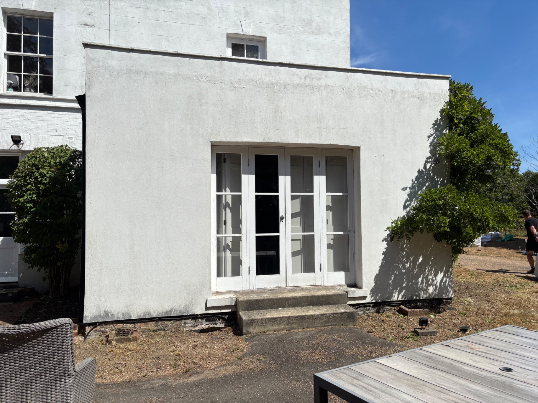Entrance steps and borders cleared back to a clean finish — after