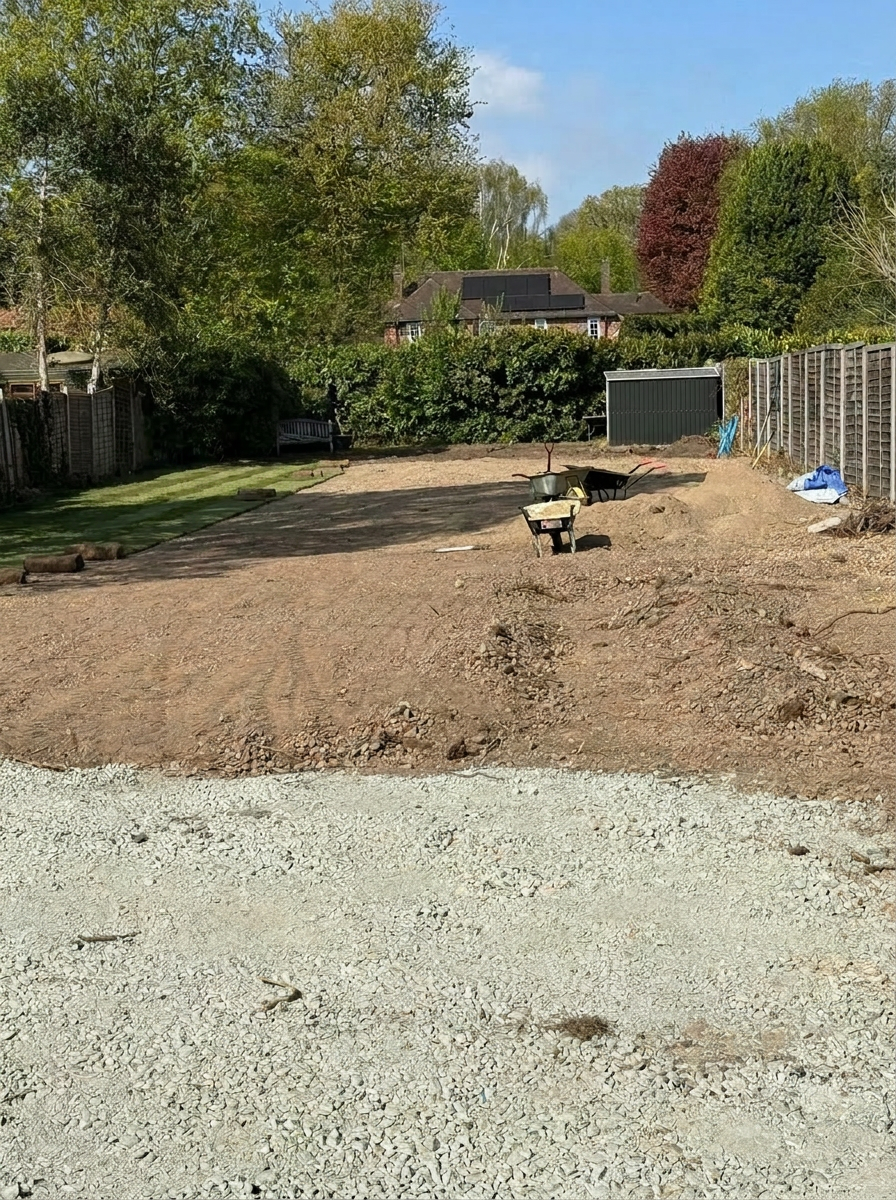 Topsoil raked and graded across the full lawn area — lawn renovation project by Gardner Contract Services